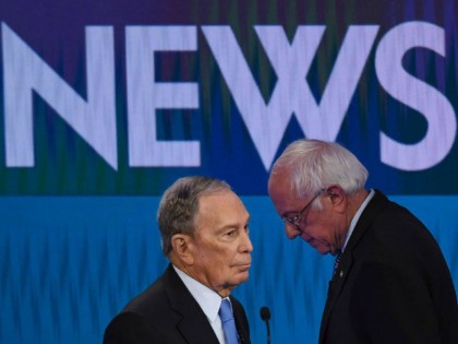 Democratic presidential hopefuls Former New York Mayor Mike Bloomberg (L) and Vermont Senator Bernie Sanders (R) speak during a break in the ninth Democratic primary debate of the 2020 presidential campaign season co-hosted by NBC News, MSNBC, Noticias Telemundo and The Nevada Independent at the Paris Theater in Las Vegas, …