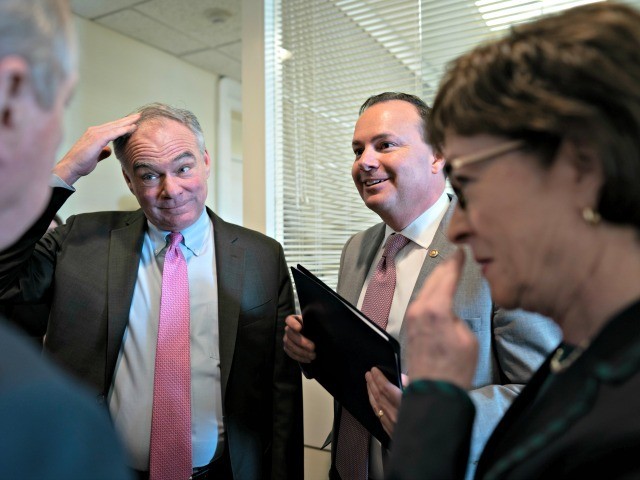 Sen. Tim Kaine, D-Va., center left, and Sen. Mike Lee, R-Utah, flanked by Sen. Dick Durbin, D-Ill., left, and Sen. Susan Collins, R-Maine, meet prior to a news conference just after the Senate advanced a bipartisan resolution asserting that President Donald Trump must seek approval from Congress before engaging in …