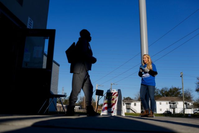 A voter exits a polling station located at Mary Ford Elementary School during the primary