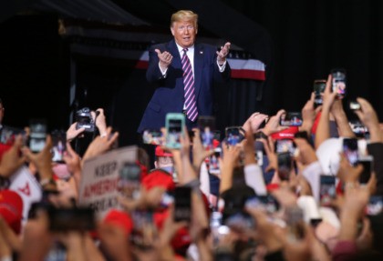 LAS VEGAS, NEVADA - FEBRUARY 21: US President Donald Trump gestures to the crowd at a camp