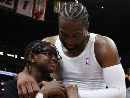 MIAMI, FLORIDA - APRIL 09: Dwyane Wade #3 of the Miami Heat hugs his son, Zion Wade, after his final career home game at American Airlines Arena on April 09, 2019 in Miami, Florida. NOTE TO USER: User expressly acknowledges and agrees that, by downloading and or using this photograph, …