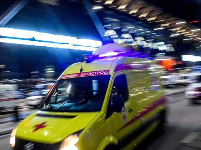 An ambulance leaves the terminal building of the Sheremetyevo Airport outside Moscow after