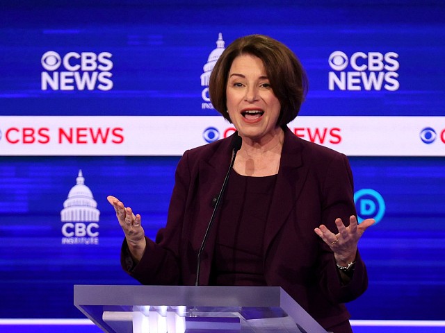 CHARLESTON, SOUTH CAROLINA - FEBRUARY 25: Democratic presidential candidate Sen. Amy Klobuchar (D-MN) speaks as former Vice President Joe Biden (L) looks on during the Democratic presidential primary debate at the Charleston Gaillard Center on February 25, 2020 in Charleston, South Carolina. Seven candidates qualified for the debate, hosted by CBS News and Congressional Black Caucus Institute, ahead of South Carolina’s primary in four days. (Photo by Win McNamee/Getty Images)