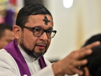 A priest officiates an Ash Wednesday Mass, as Catholic faithful begin the Lent observance, at Tegucigalpa's Cathedral on February 26, 2020. (Photo by ORLANDO SIERRA / AFP) (Photo by ORLANDO SIERRA/AFP via Getty Images)