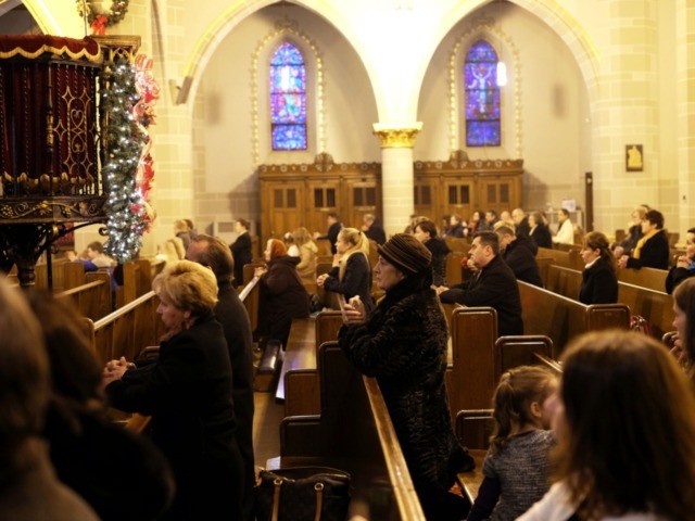 Faithful pray during Sunday Mass at a Polish catholic church in Hamtramck, Michigan, on January 10, 2016. Known in the 20th century as a vibrant center of Polish American life and culture, Hamtramck - located on the outskirts of Detroit, has continued to attract immigrants. AFP PHOTO/JEWEL SAMAD / AFP …