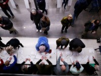 Caucus goers check in at a caucus at Roosevelt Hight School, Monday, Feb. 3, 2020, in Des Moines, Iowa. (AP Photo/Andrew Harnik)