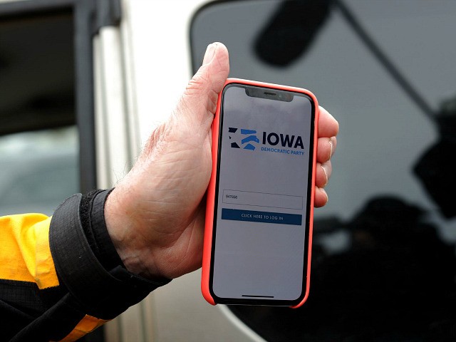 DES MOINES, IOWA - FEBRUARY 04: Carl Voss, Des Moines City Councilman and a precinct chair, shows photographers the app that was used for caucus results reporting on his phone after he unsuccessfully attempted to drop off a caucus results packet from Precinct 55 at the Iowa Democratic Party headquarters …
