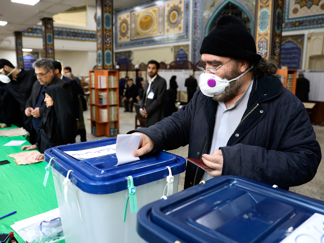 A voter casts his ballot in the parliamentary elections in a polling station in Tehran, Ir