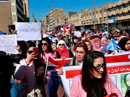 Women take part in a protest in Tahrir Square, Baghdad, Iraq, Thursday, Feb. 13, 2020. Hun