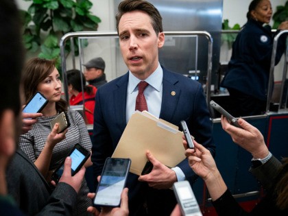 WASHINGTON, DC JANUARY 6: U.S. Sen. Josh Hawley (R-MO) speaks with reporters about Iran and a potential Senate impeachment trial in the Senate Subway at the U.S. Capitol January 6, 2020 in Washington, DC. Secretary of State Pompeo was reportedly at the Capitol to brief a small group of Senators …