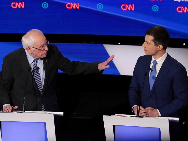 DES MOINES, IOWA - JANUARY 14: Former South Bend, Indiana Mayor Pete Buttigieg (R) listens as Sen. Bernie Sanders (I-VT) makes a point during the Democratic presidential primary debate at Drake University on January 14, 2020 in Des Moines, Iowa. Six candidates out of the field qualified for the first …