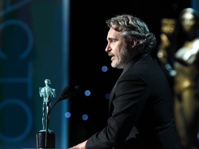 LOS ANGELES, CALIFORNIA - JANUARY 19: Joaquin Phoenix accepts the Outstanding Performance