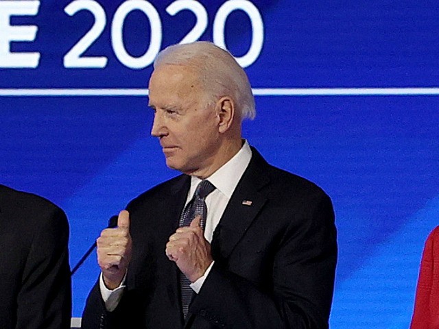 MANCHESTER, NEW HAMPSHIRE - FEBRUARY 07: (L-R) Democratic presidential candidates former South Bend, Indiana Mayor Pete Buttigieg, Sen. Bernie Sanders (I-VT), Sen. Elizabeth Warren (D-MA), and former Vice President Joe Biden, arrive on stage for the start of a Democratic presidential primary debate in the Sullivan Arena at St. Anselm …
