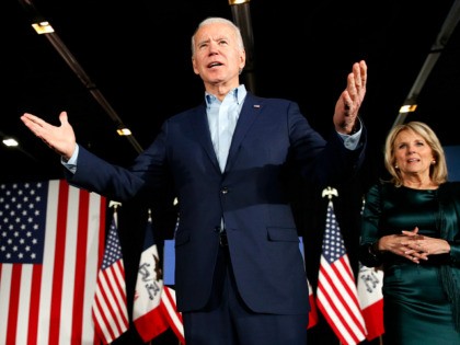 Democratic presidential candidate former Vice President Joe Biden at a caucus night campaign rally on Monday, Feb. 3, 2020, in Des Moines, Iowa, with Jill Biden. (AP Photo/John Locher)