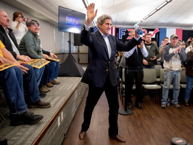 Former Secretary of State John Kerry arrives at a campaign stop for Democratic presidential candidate former Vice President Joe Biden at the South Slope Community Center, Saturday, Feb. 1, 2020, in North Liberty, Iowa. (AP Photo/Andrew Harnik)