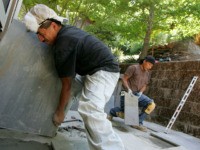 SAN RAFAEL, CA - MAY 23: Illegal immigrants Misael Amrocio (L) and Jose Augustine, both of Guatemala, layout a flagstone patio while working on a landscaping job May 23, 2007 in San Rafael, California. Both Misael and Jose came to the United States from Guatemala and are currently living and …