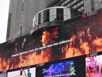 Volunteer U.S. firefighters and their compatriots from around the world have been publicly thanked by Australia for their help over the past four months, courtesy of a billboard and video display in New York's Times Square.
