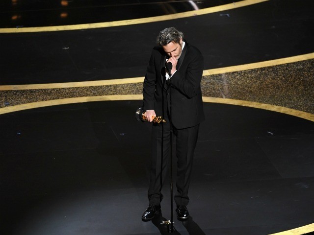 HOLLYWOOD, CALIFORNIA - FEBRUARY 09: Joaquin Phoenix accepts the Actor In A Leading Role a