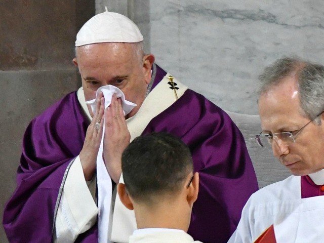 Pope Francis blows his nose as he leads the Ash Wednesday mass which opens Lent, the forty