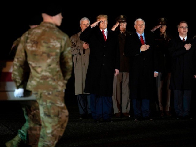 US President Donald Trump (L) and Vice President Mike Pence (C) observe the dignified transfer of two US soldiers, killed in Afghanistan, at Dover Air Force Base in Dover, Delaware, on February 10, 2020 with . - The two soldiers have been identified as Sgt. 1st Class Javier Jaguar Gutierrez, …