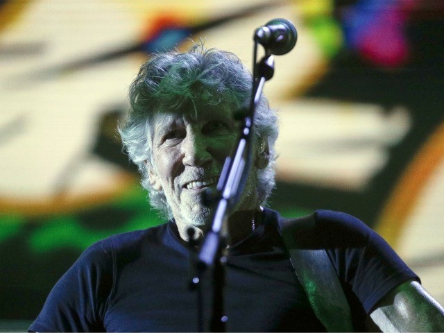 Former member of Pink Floyd, British singer and songwriter Roger Waters performs during his concert of the Us+Them tour in Rome's Circus Maximus, Saturday, July 14, 2018. (AP Photo/Gregorio Borgia)