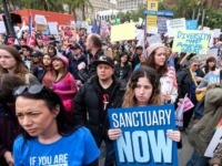 FILE - In this Feb. 18, 2017, file photo, thousands of people take part in the "Free the People Immigration March," to protest actions taken by President Donald Trump and his administration, in Los Angeles. A federal appeals court has given the Trump administration a rare legal win in its &hellip;