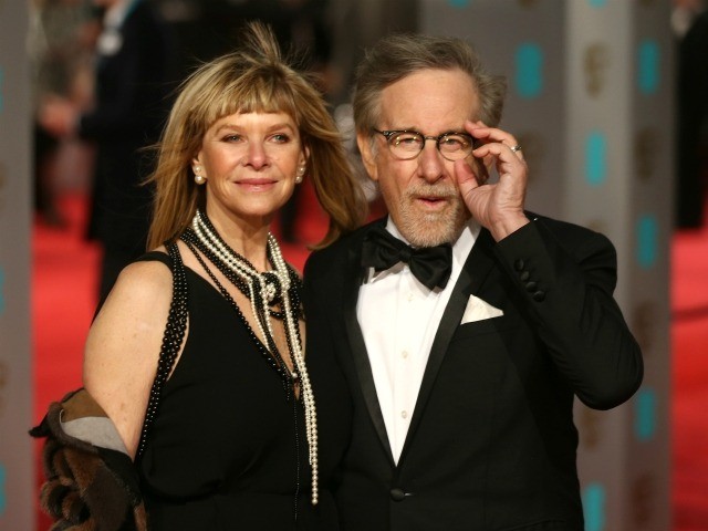 US director Steven Spielberg (R) and wife Kate Capshaw pose on arrival for the BAFTA British Academy Film Awards at the Royal Opera House in London on February 14, 2016. AFP PHOTO / JUSTIN TALLIS / AFP / JUSTIN TALLIS (Photo credit should read JUSTIN TALLIS/AFP via Getty Images)