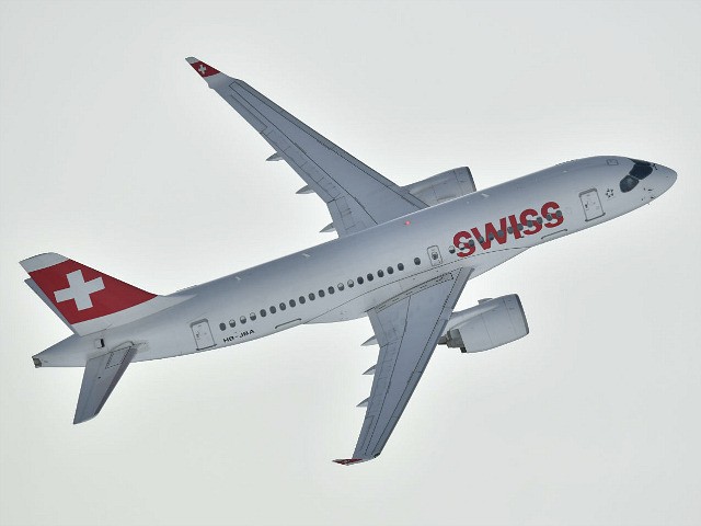 An Airbus commercial plane of Swiss International Air Lines flies before the women's downh