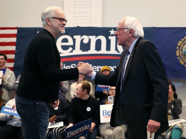 HANOVER, NEW HAMPSHIRE - FEBRUARY 09: Actor Tim Robbins (L) shakes hands with Democratic p