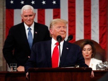 trump-pence-smile-pelosi-sits-sotu-2020-getty Leah Millis-Pool/Getty Images