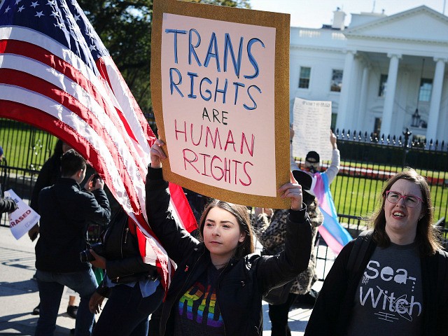 WASHINGTON, DC - OCTOBER 22: L.G.B.T. activists from the National Center for Transgender Equality, partner organizations and their supporters hold a 'We Will Not Be Erased' rally in front of the White House October 22, 2018 in Washington, DC. Members of the L.G.B.T. community and their supporters across the country …