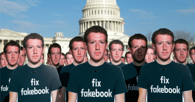 One hundred cardboard cutouts of Facebook founder and CEO Mark Zuckerberg stand outside th