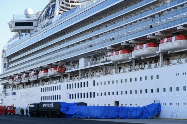 Japan woman with coronavirus dies as cruise ship cases soar