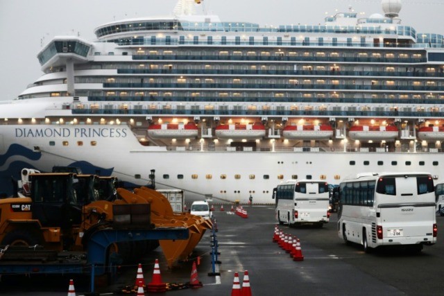 Americans leave quarantined Japan ship as virus cases hit 355