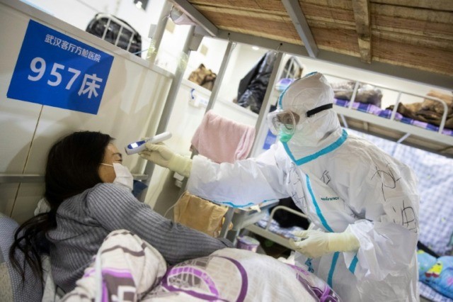 WHO urges calm as China virus death toll nears 1,900