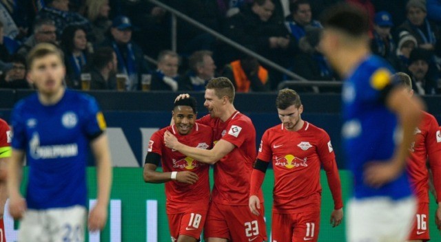 Halstenberg (C) celebrates during Leipzig's 5-0 thrashing of Schalke Leipzig 'tough to stop' in title race after thrashing Schalke