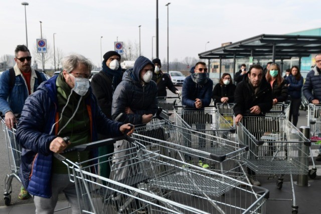Italy towns wake to quarantine, queue for food in coronavirus outbreak