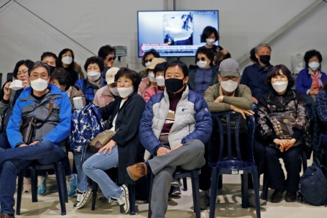 WHO warns of pandemic risk after virus peaks in China
