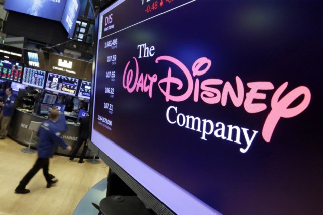 Disney Results The Walt Disney Company In this Aug. 8, 2017, file photo, The Walt Disney Co. logo appears on a screen above the floor of the New York Stock Exchange. The Walt Disney Co. said Tuesday, Feb. 4, 2020, that profit fell 23% in its latest quarter to $2.13 billion as it absorbed losses, and a big revenue boost, from its new streaming service, Disney Plus. (AP Photo/Richard Drew, File) The Associated Press