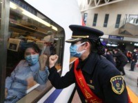 World Health Organization - This photo taken on February 13, 2020 shows a train attendant gesturing to medical staff leaving for Wuhan in Nanchang, China's central Jiangxi province. - The death toll from the COVID-19 coronavirus epidemic neared 1,400 on February 14, as the United States complained of a "lack …