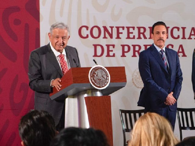 Mexican President Andrés Manuel López Obrador stands near Hidalgo Governor Omar Fayad du