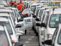A taxi driver reacts as they wait to show their ID and car documents to police who instructed them to stop operations while the government implements localized quarantining as a precautionary measure against the spread of the new coronavirus in Manila, Philippines, early Tuesday, March 17, 2020. For most people, …