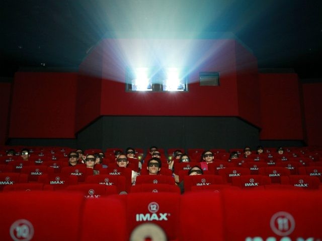 Patrons watch a 3D IMAX movie at a theater of Wanda cinema run by Dalian Wanda Group Co. i