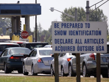 A line of cars wait to enter the United States from Canada Tuesday, July 21, 2009, in Blaine, Wash. The world's longest undefended border is a catchy yet increasingly imprecise term for the U.S.-Canada frontier, as authorities on both sides ratchet up efforts to curb bustling traffic in illegal drugs …