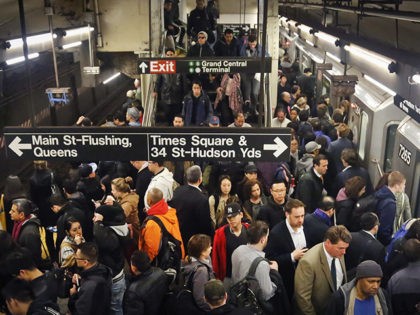 FILE - In this May 4, 2016 file photo, commuters crowd a Grand Central subway station plat