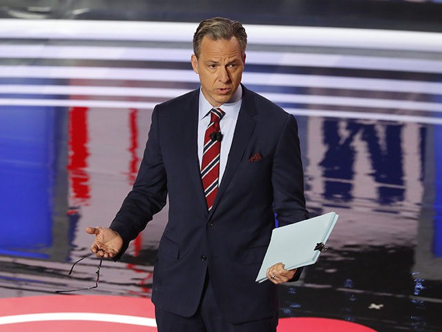 Jake Tapper speaks before the first of two Democratic presidential primary debates hosted by CNN Tuesday, July 30, 2019, in the Fox Theatre in Detroit. (AP Photo/Paul Sancya)