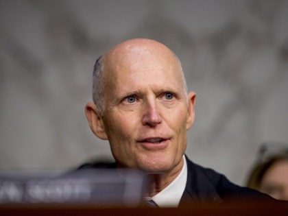 Sen. Rick Scott, R-Fla., questions FBI Director Christopher Wray during a Senate Homeland Security Committee hearing on Capitol Hill in Washington, Tuesday, Nov. 5, 2019. Also pictured is Sen. Rick Scott, R-Fla., left. (AP Photo/Andrew Harnik)