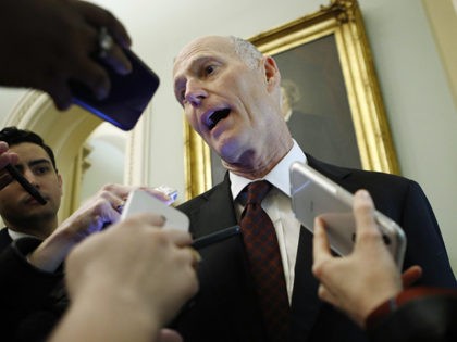 Sen. Rick Scott, R-Fla., talks to reporters prior to the start of the impeachment trial of President Donald Trump at the Capitol, Wednesday, Jan 29, 2020, in Washington. (AP Photo/Steve Helber)