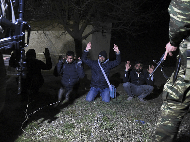 Greek Army arrest migrants in the village of Kastanies, Evros region, near the Greek-Turkish border on Friday, March 6, 2020. (AP Photo/Giannis Papanikos)