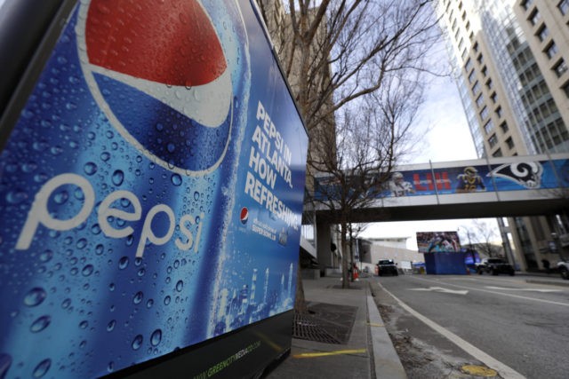 FILE - In this Jan. 30, 2019, file photo, an advertisement for Pepsi is shown downtown for